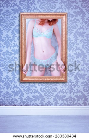 body of a woman wearing lingerie as a picture on the wall with nice wallpaper