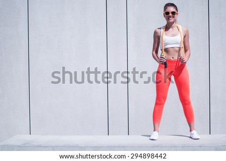 Full Length Shot of a Fit Young Woman Holding a Jumping Rope Over her Shoulders with Copy Space on the Left Side of the Frame.