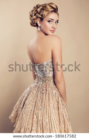 beautiful blond woman in elegant sequin dress