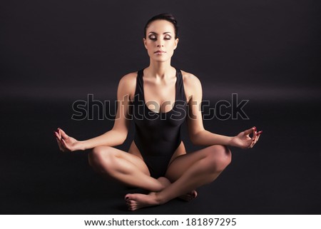 beautiful woman relaxing  in lotus yoga pose