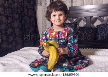 cute little girl with bananas