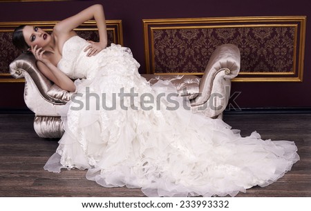 fashion interior photo of beautiful glamour bride with retro hairstyle in elegant wedding dress