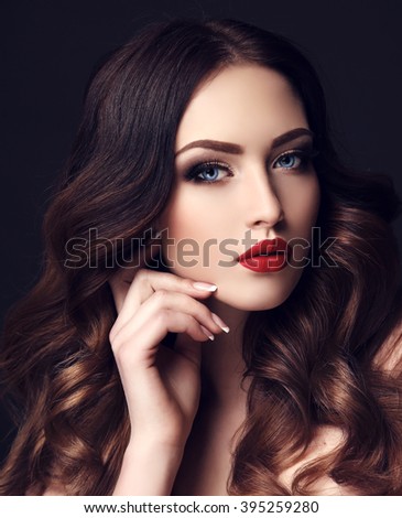 fashion studio photo of gorgeous sexy woman with dark hair and bright makeup