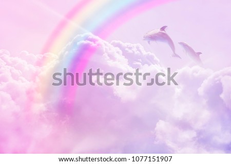 magic rainbow fantasy cloud background  fluffy sky white landscape with sunny rays. Pastel colors sleep dreams 	\
slumber dolphins realistic photo collage concept