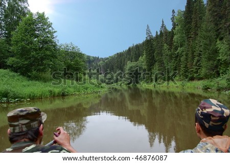 Fishermen float on the river. Russia, Ural