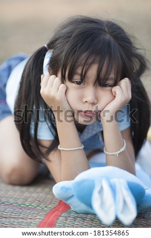 Cute little girl shutting down her ears