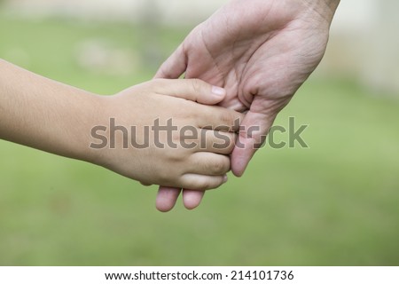Hands of mother and son