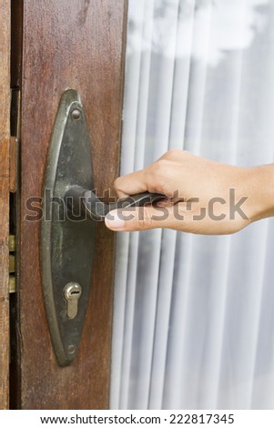 door with a hand on handle