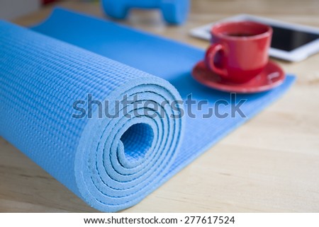 yoga mat and a cup of coffee