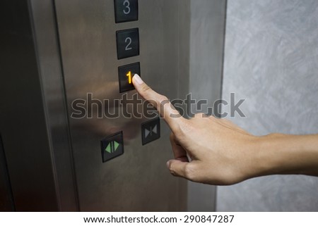 businesswoman hand press 1 floor in elevator