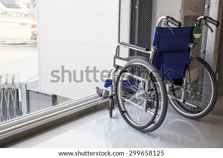 Empty wheelchair parked in airport