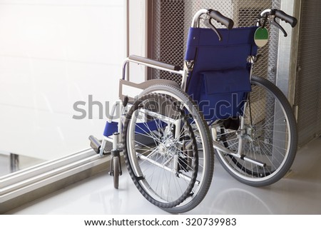 Empty wheelchair parked in airport