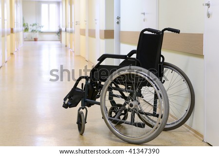 Wheel chair in the hospital corridor.