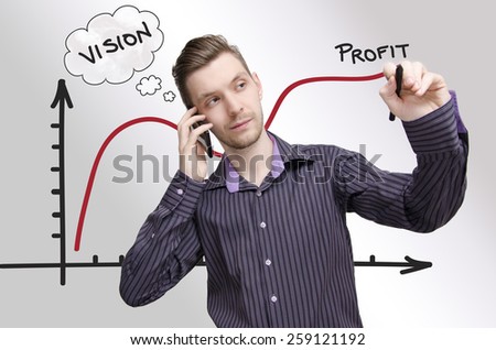Young businessman drawing profit chart, while talking on phone. Young adult having vision how to make profit