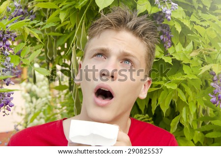 Teenage boy preparing to sneeze, allergies concept