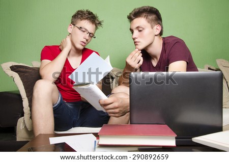 Two friends focused while studying