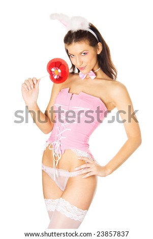 stock photo Young sexy bunnygirl with red lollipop isolated on white 