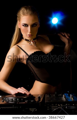 Beautiful DJ girl in the nigh club