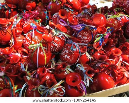Red clay pots with colorful ribbons for Easter in Corfu, Greece