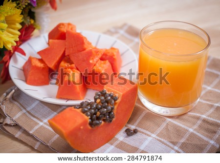 papaya fruit and glass of juice