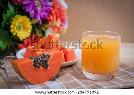papaya fruit and glass of juice