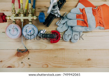 Air Conditioning Technician. manometers measuring equipment for filling air conditioners,gauges.Tools for HVAC