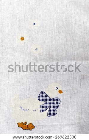 Dishtowel with printed images of flowers and chicks