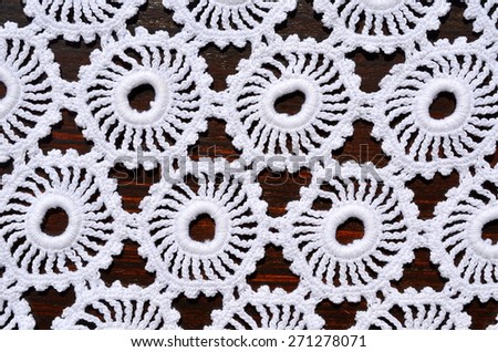 Handmade, crocheted tablecloth with round elements