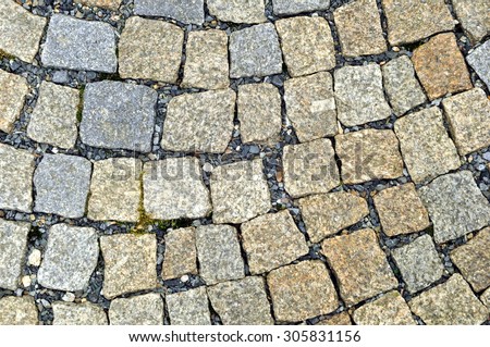 Granite cobblestoned pavement background. Stone pavement texture.