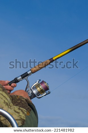 Fishing gear on blue sky background