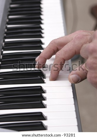 piano keys and hand