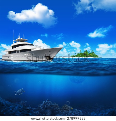 White yacht in the sea. Beautiful beach with palm trees on the horizon. Underwater turtle and coral.