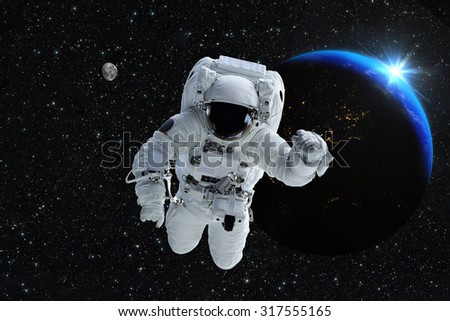 Astronaut spaceman outer space people planet earth moon. Beautiful blue sunrise. Elements of this image furnished by NASA.