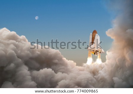 Space Shuttle starts its mission and takes off into the sky. Rocket with clouds of smoke flying into space