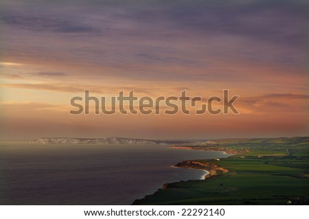 sunset over the southern isle of wight coast, England.