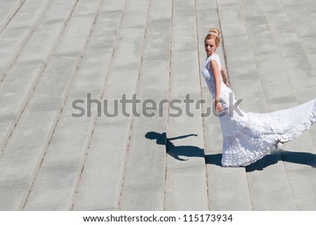 Beautiful fashionable bride on the stairs