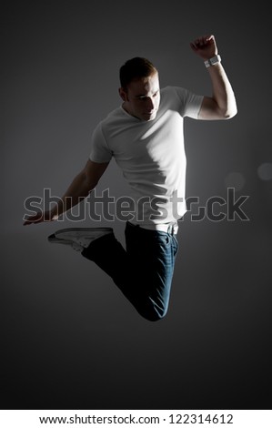 Jumping man on gray background