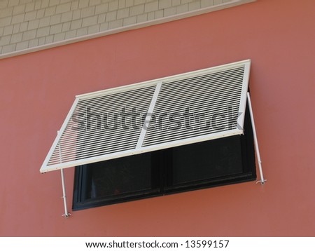 window awning	on side wall of building