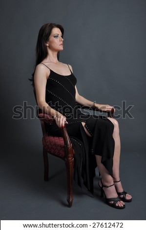 a long haired brunette in an evening gown