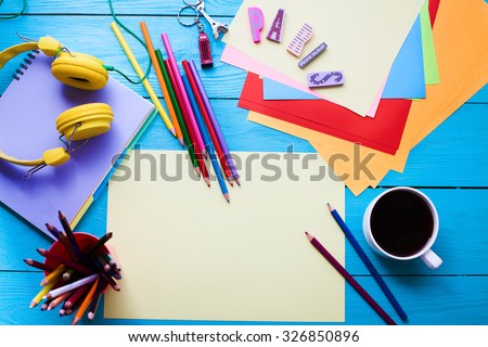 Education accessories on blue wooden table. Top view