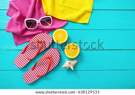 Summer fun time and accessories on blue wooden background. Mock up