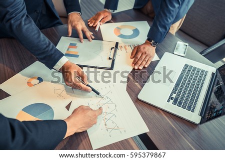 businessmen meeting, Business partners discussing hand pointing at business documents and ideas at meeting