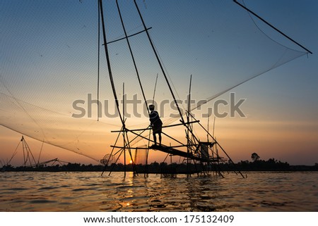 The fishing village at Udonthani province, north-east of Thailand. They still use the classic tool for fishing. This photo was shot at the sunset time.