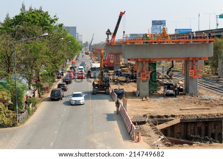 BANGKOK THAILAND - MAR 2 2014: Builder team are building new Sky Train station on Local road, Bangkok Thailand.