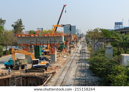 BANGKOK THAILAND - MAR 2 2014: Builder team building new Sky Train station on Local road, Bangkok Thailand.
