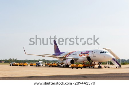 Ubonratchathani, Thailand - June 5 2015: Thai Smile plane loading baggage and waited fly at Ubonratchathani airport.