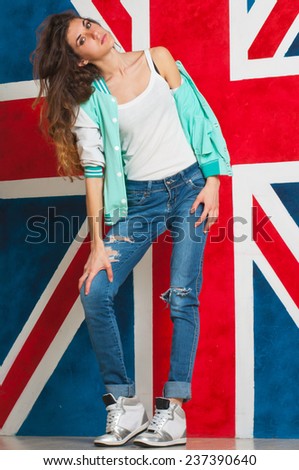 Young woman standing with the UK flag in the background