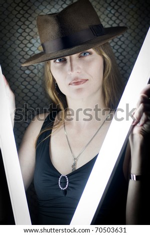 The girl in a hat, having control over illumination lamps
