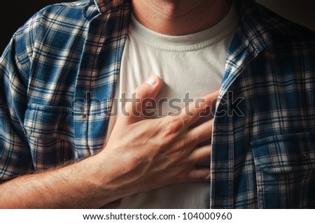 Man suffering from severe chest pain.