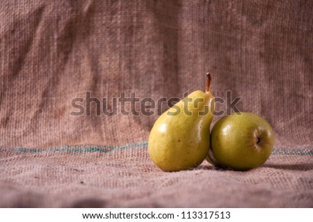 Tasty yellow pears on table; agriculture background image - organic food production